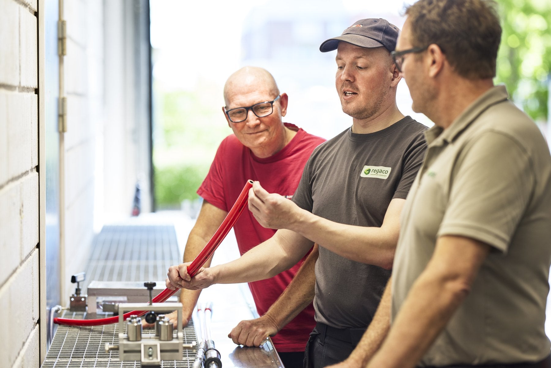 Regaco technicians servicing CNG refuelling equipment in the Copenhagen workshop
