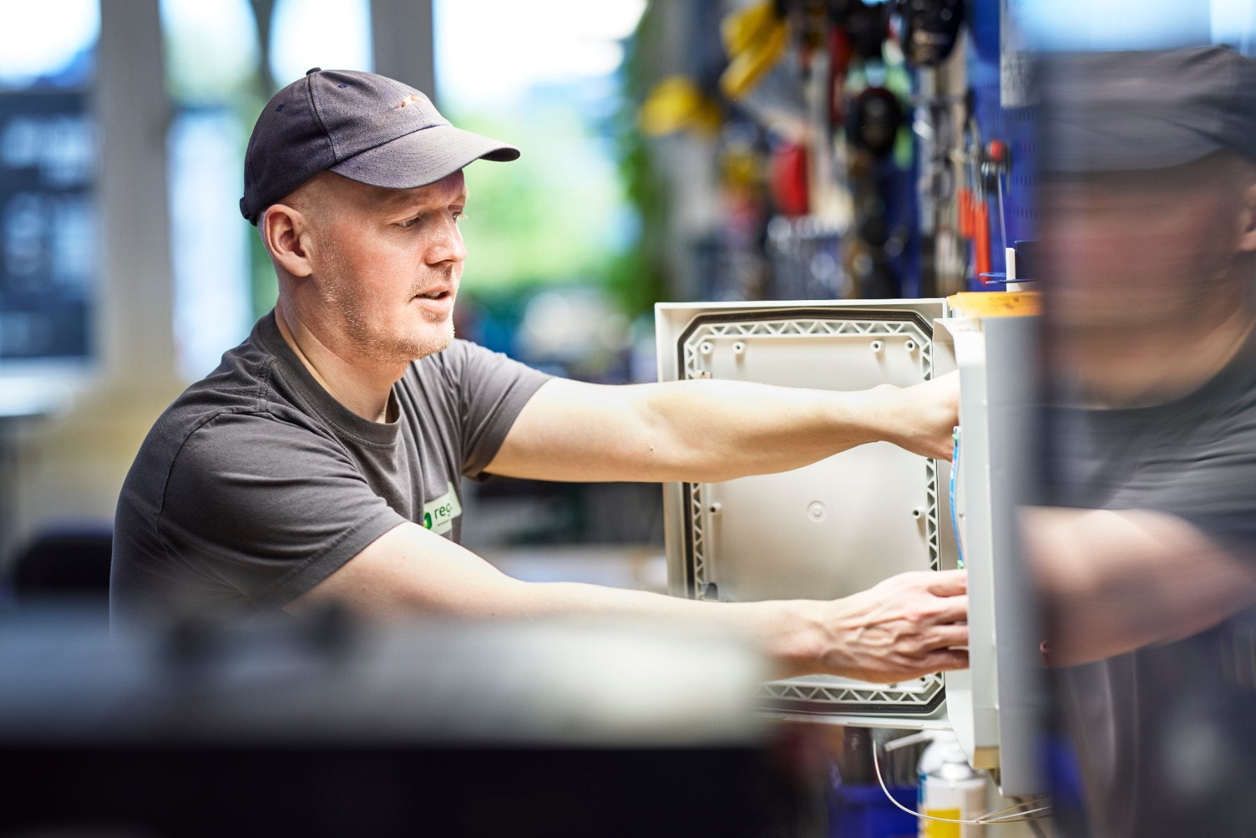 Sherex technician servicing CNG refuelling equipment at the Regaco workshop